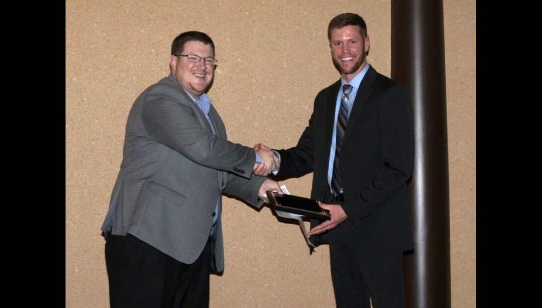 Josh Gordon (right) received the Outstanding New Agronomist award among Crop Specialists at Servi-Tech where he is currently employed. —Courtesy photo
