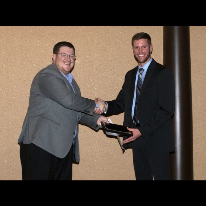 Josh Gordon (right) received the Outstanding New Agronomist award among Crop Specialists at Servi-Tech where he is currently employed. —Courtesy photo