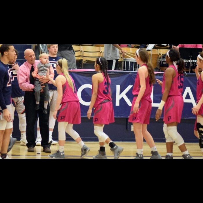 Four year-old Monson Wilkins was surrounded with support during Saturday's basketball double-header as the Aggies hosted a Pink Out and Silent Auction fundraiser for Monson, who is currently undergoing treatment for Leukemia.-Rylee Higgins photo