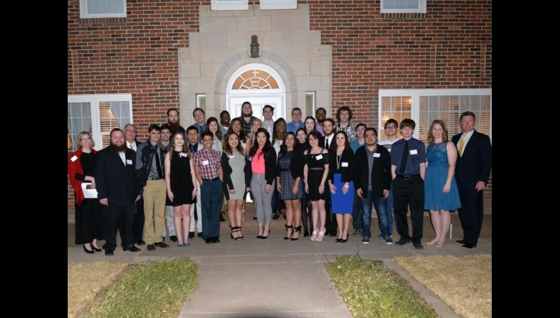 Members of the campus organizations AITP and PBL along with their faculty advisors and President Dr. Tim Faltyn gather for a photo before the second annual Perfect Pairings hosted at the University House. —Photo by Danae Moore