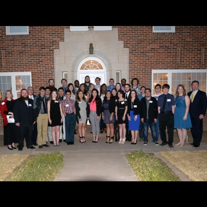Members of the campus organizations AITP and PBL along with their faculty advisors and President Dr. Tim Faltyn gather for a photo before the second annual Perfect Pairings hosted at the University House. —Photo by Danae Moore