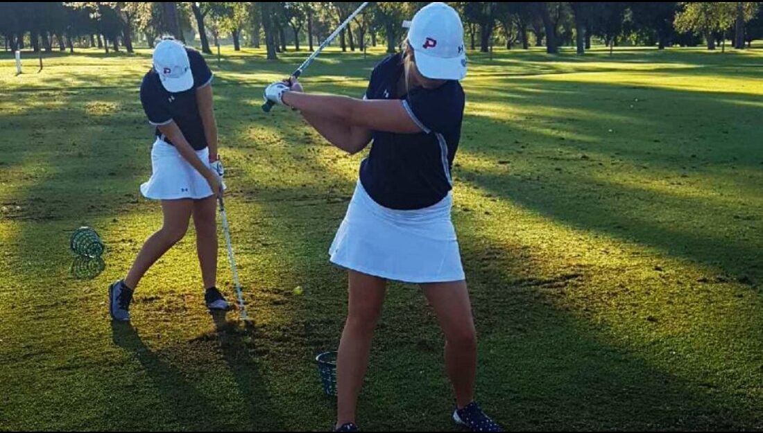 Jacey Steel and Emilee Smith warm up on the range before hitting the links at the NWOSU Ranger Invitational.-Courtesy photo 