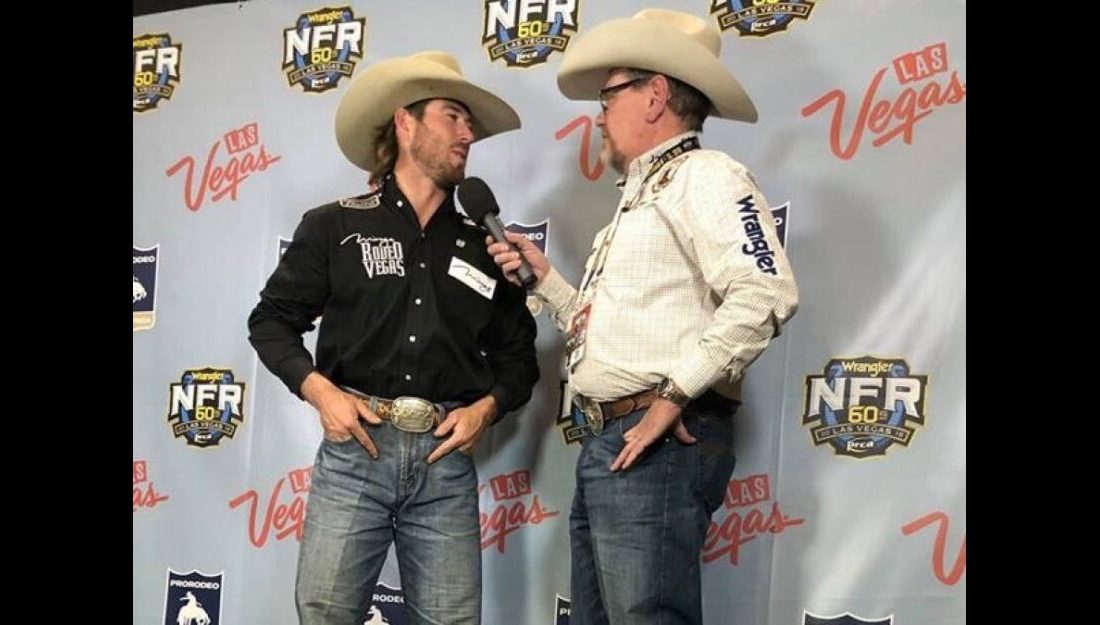 Panhandle State graduate and former Rodeo team member Cort Scheer (left) stops for an interview with Voice of the Aggies Derek Barton after claiming the top spot of the saddle bronc riding for the second night in a row on Friday, December 7, 2018. —Courtesy photo