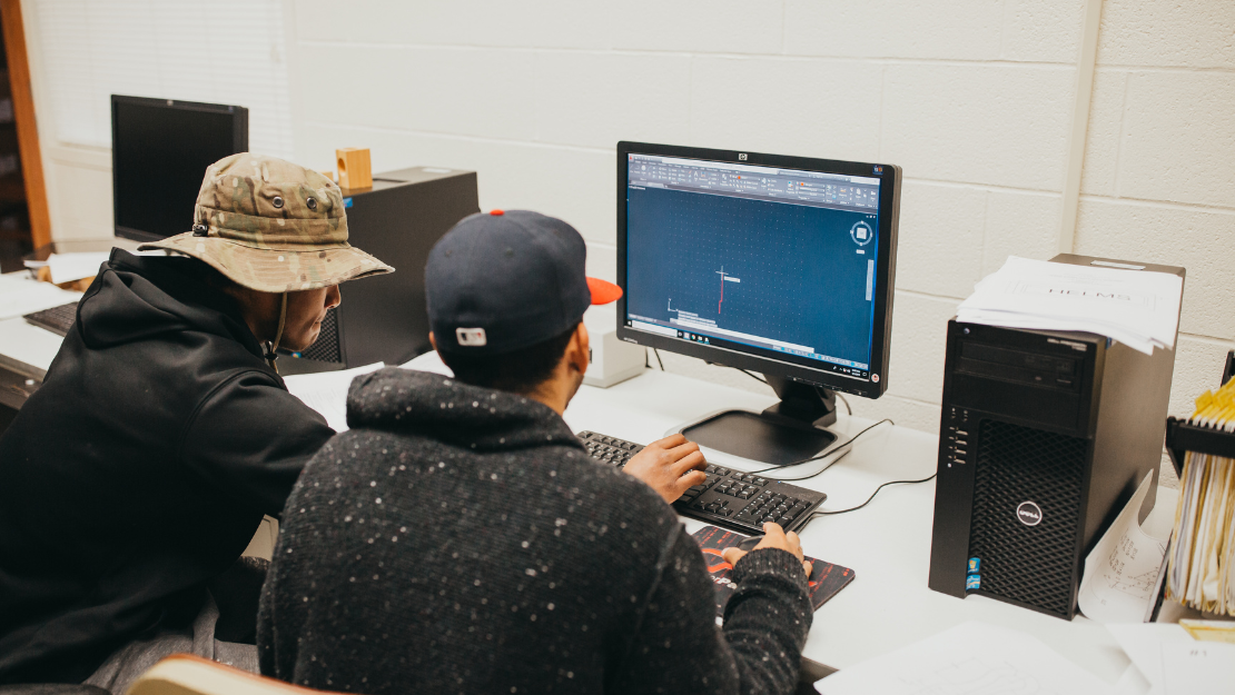 OPSU CIS Students working on a computer