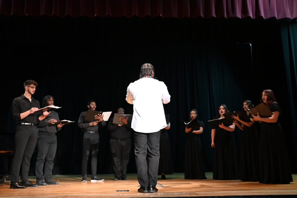 Professor Cooke Directing OPSU Choir Performers 